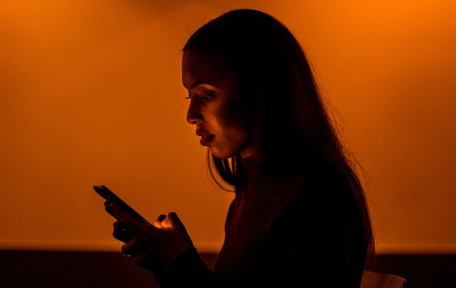 woman looking at her phone 