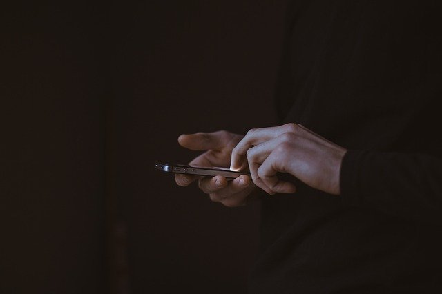 hands navigating to the phone 