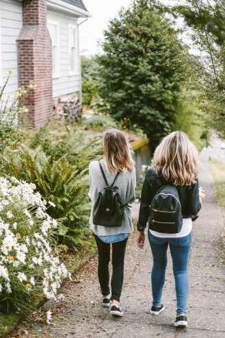 two girls walking outside