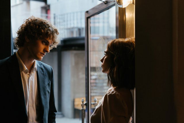 man and woman staring each other 