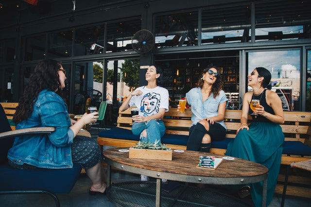 girl friends hanging out in a restaurant 