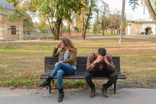 couple arguing in a park 