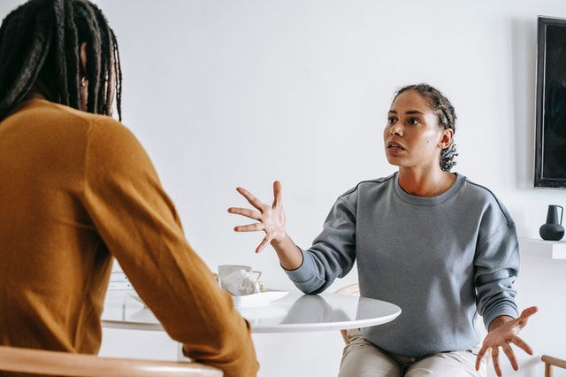 African American couple arguing at table