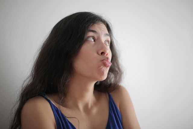 woman pouting her lips