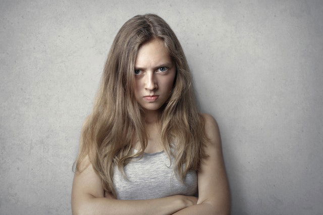 woman in gray tank top angry 