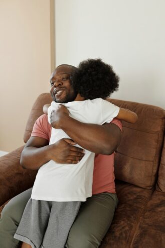 father and son hugging 