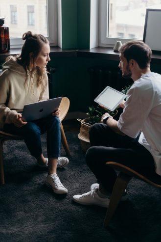 man and woman talking 