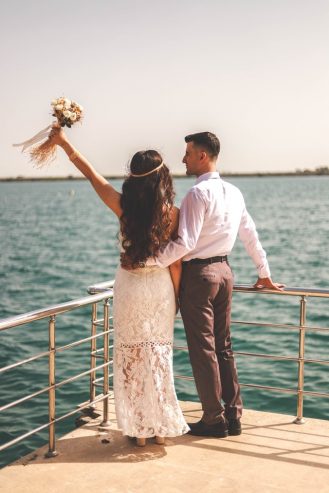 married couple standing near metal railings