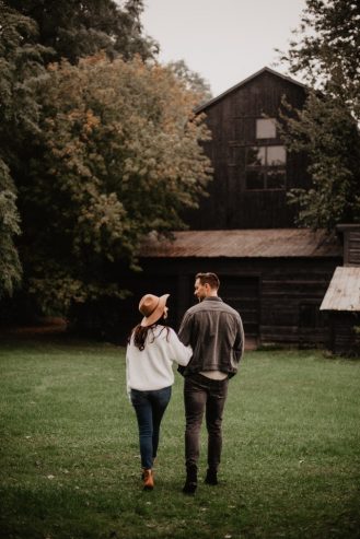 couple standing on green grass