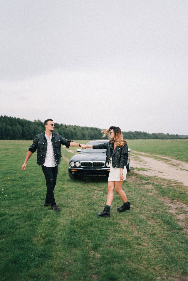couple walking and holding hands 