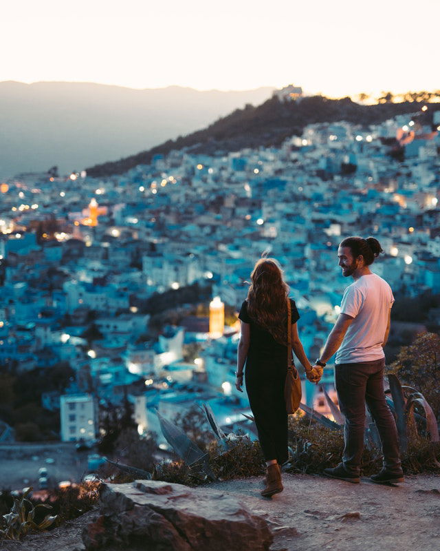 man and woman holding hands 