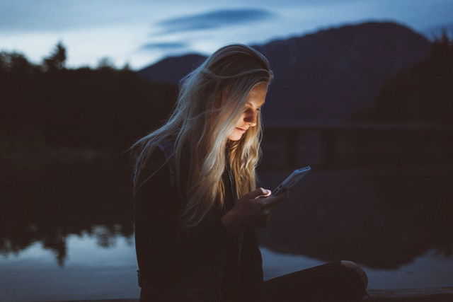 woman checking her phone 
