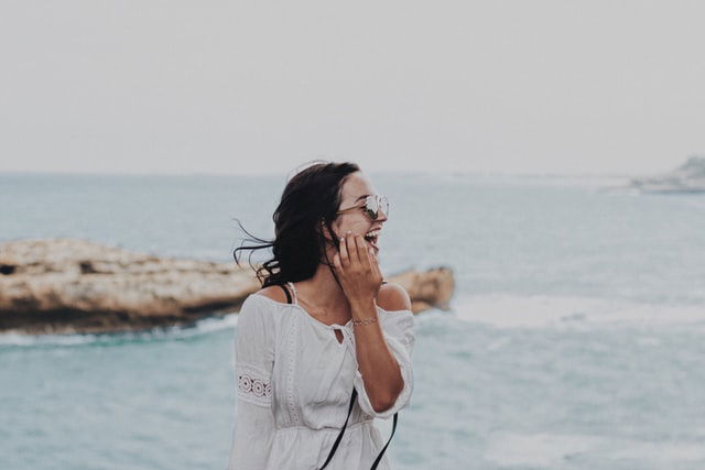 woman wearing shades smiling 