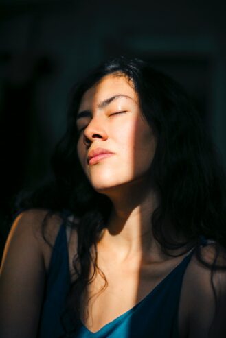 woman closing her eyes 