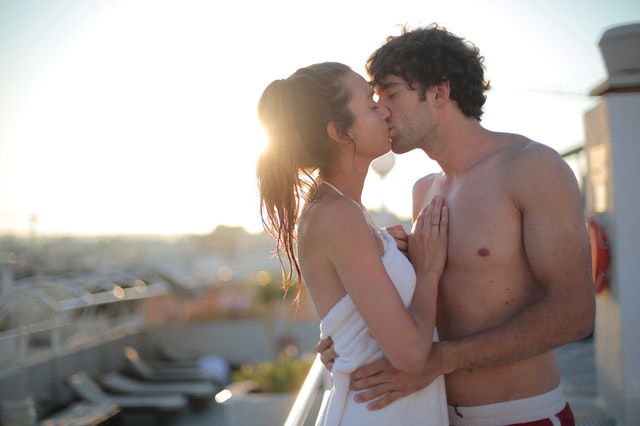 man and woman kissing 