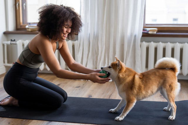 woman playing with her dog